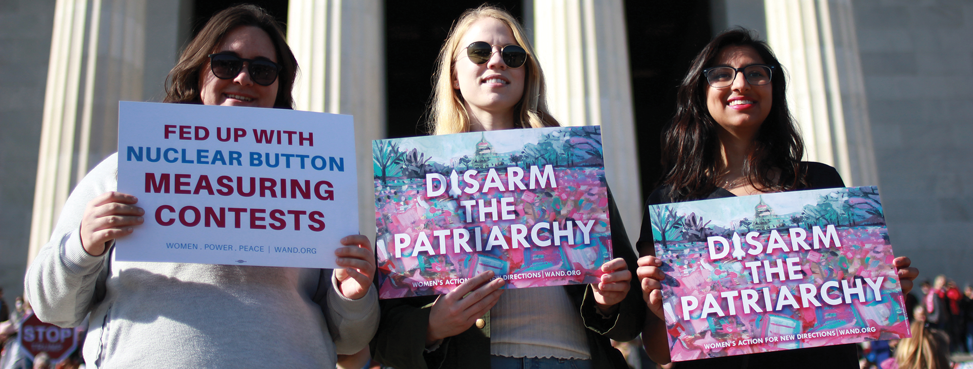 Women's Action for New Directions with 'Disarm the Patriarchy' signs at the 2018 Women's March, Washington, DC. Image: Corey Greer, WAND
