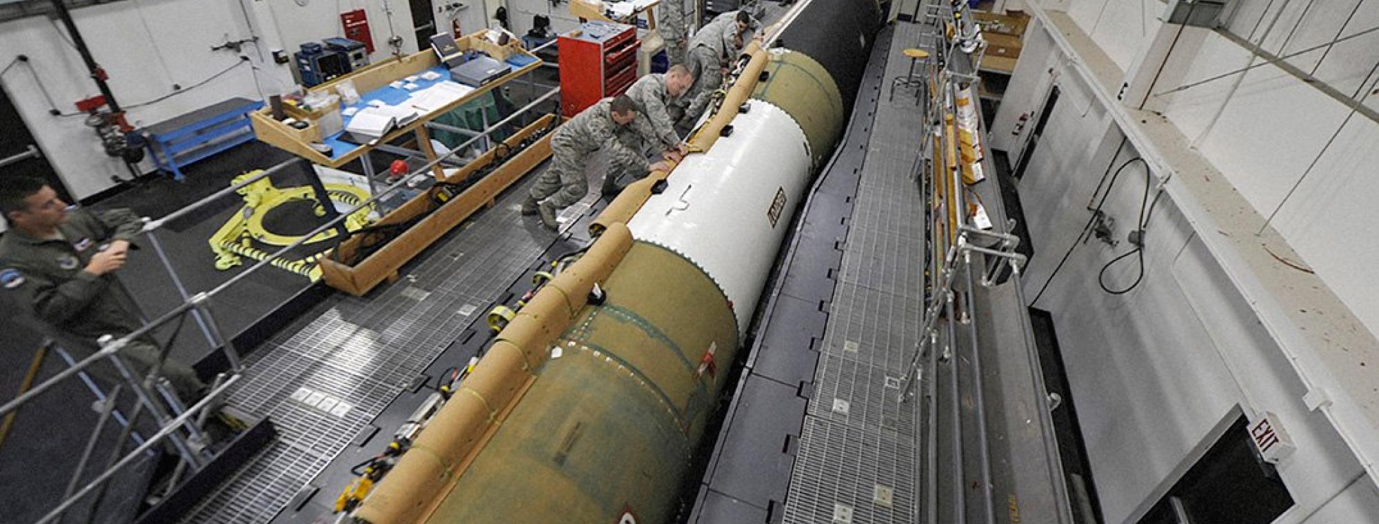 Airmen install a new cable run on an aging Minuteman III ICBM.